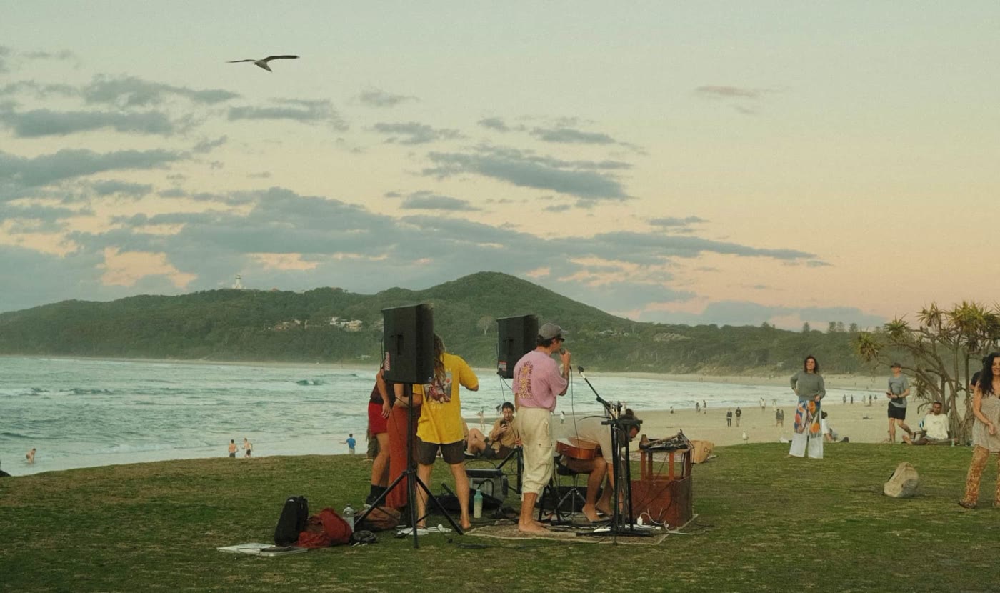A sunset gathering on the grass above the beach
