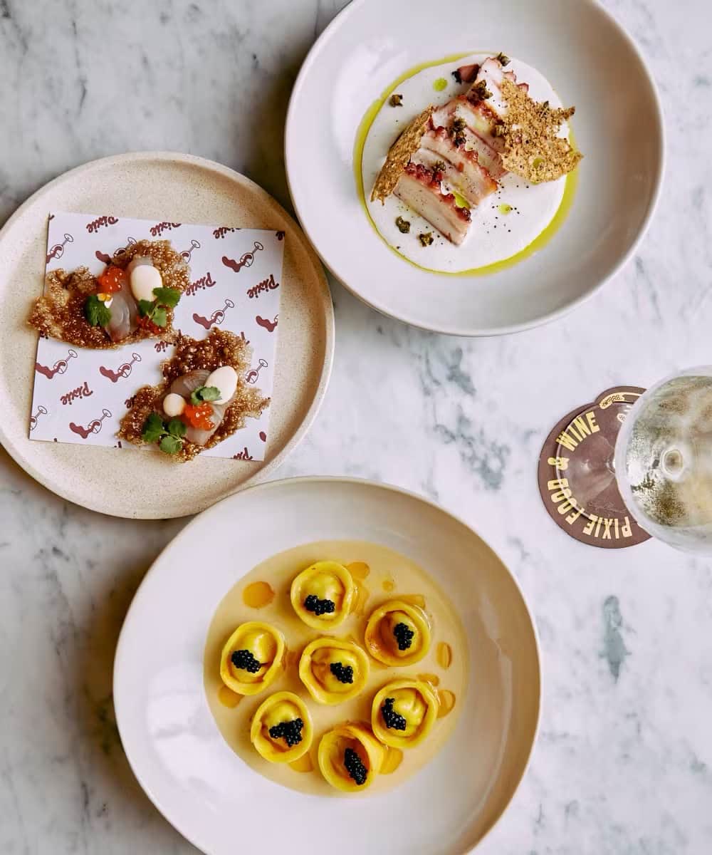 Plates from a Byron kitchen, set for the table