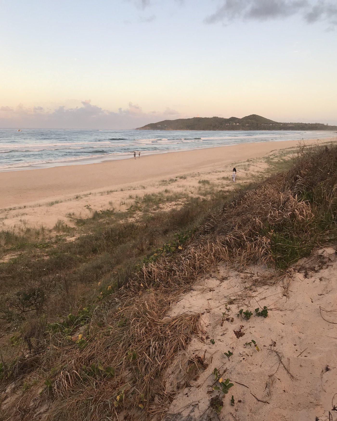 The creek mouth cutting across the sand at Belongil